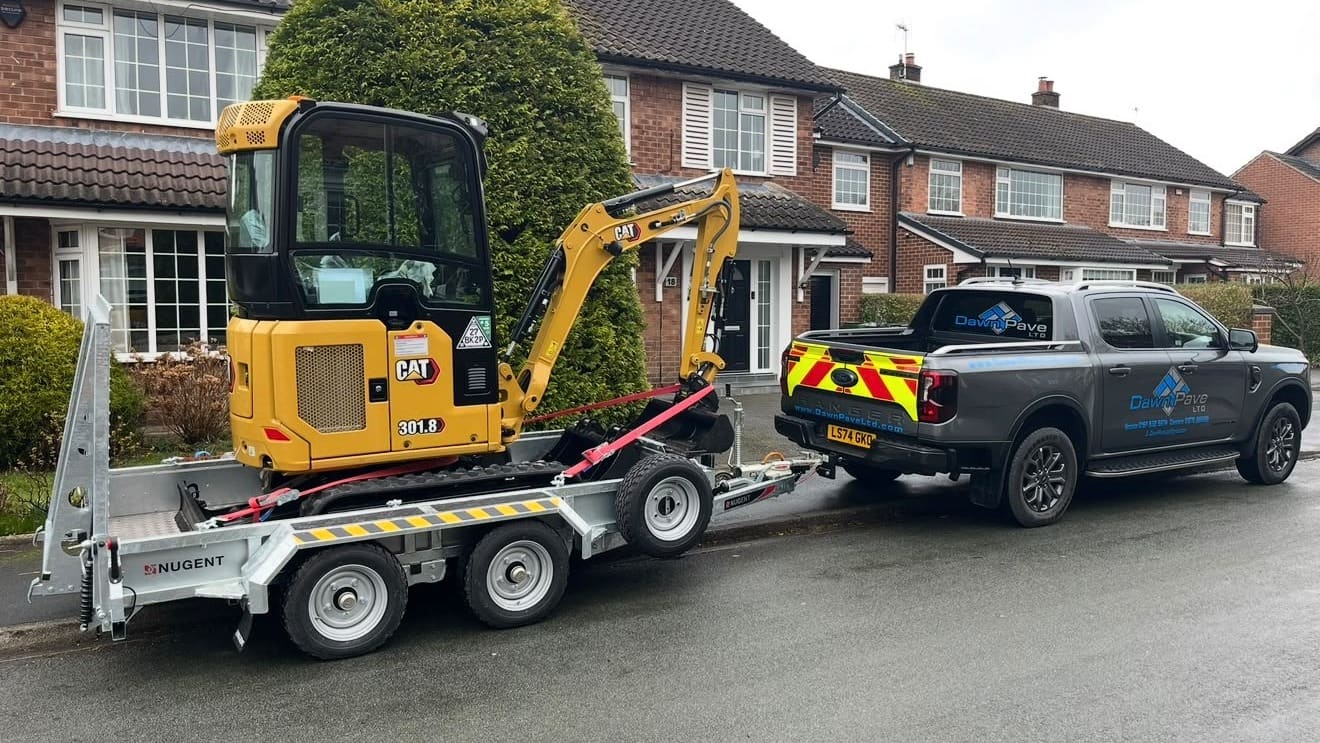 Dawn Pave LTD works truck and digger on site